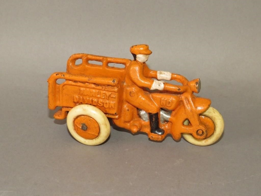CAST IRON ORANGE PAINTED TOY HARLEY