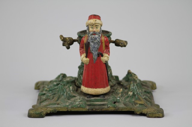 CAST IRON SANTA ON CHRISTMAS TREE