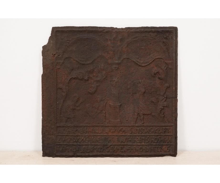 Cast iron stove plate depicting