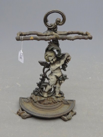 Cast iron umbrella rack with cherub