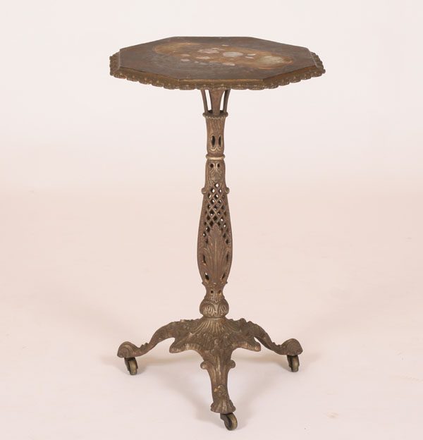 Cast metal tilt top table with