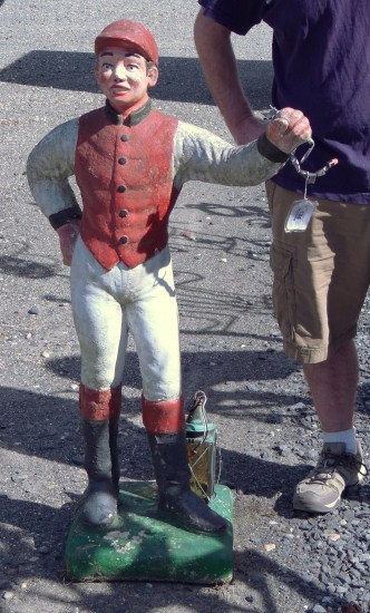 Cement lawn jockey.