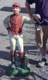 Cement lawn jockey.
