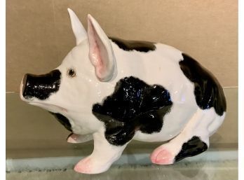 Ceramic pig in black and white,