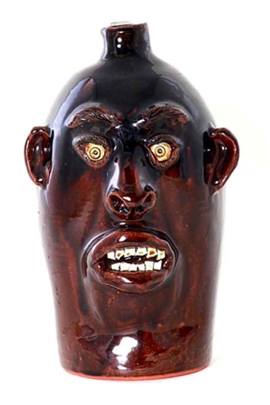 Charlie Brown stoneware face jug