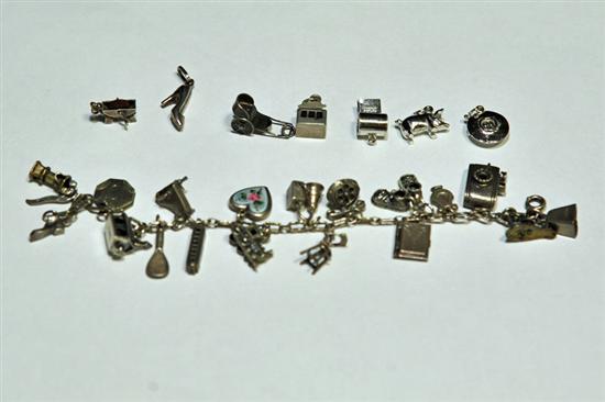 CHARM BRACELET. Eighteen charms
