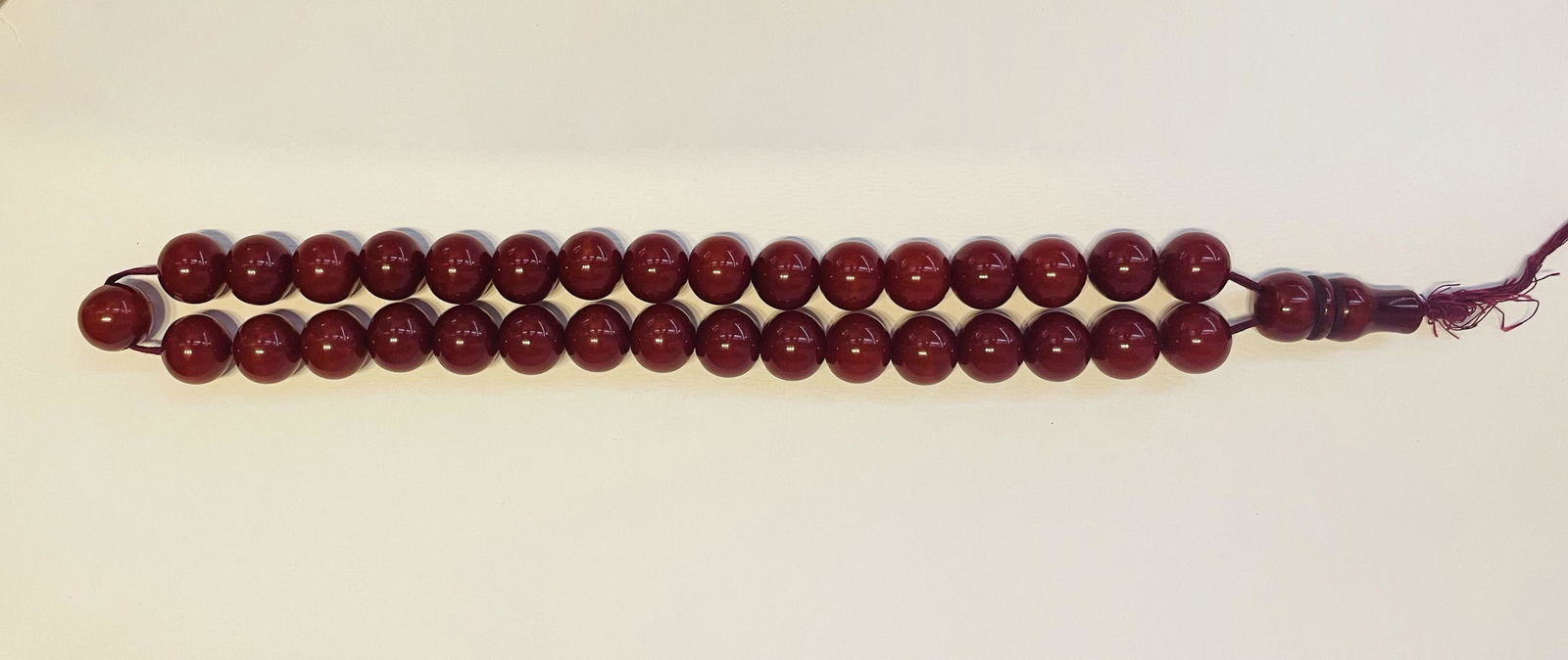 CHERRY AMBER BAKELITE OTTOMAN,
