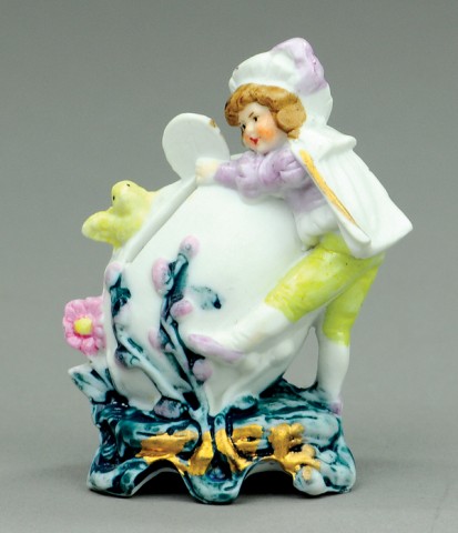 CHILD WITH EGG AND BIRD STILL