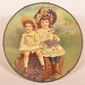CHILDREN SITTING ON BASKET OF