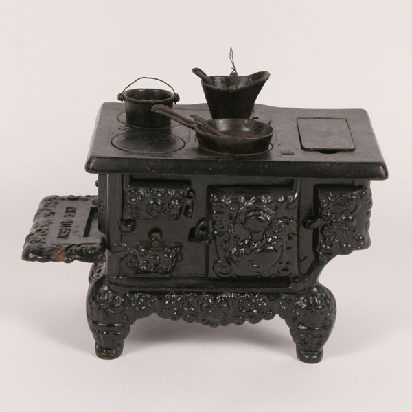 Child's toy stove; "The Queen" cast