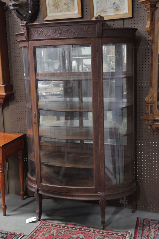 CHINA CABINET. Oak having a foliate