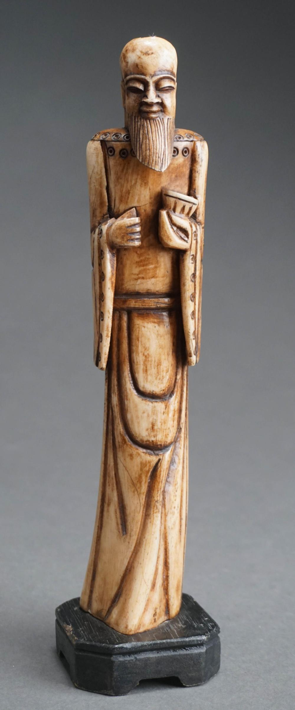 CHINESE CARVED BONE STANDING FIGURE