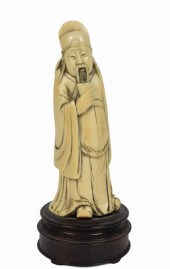 CHINESE CARVED FIGURE OF A STA