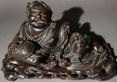 CHINESE CARVED HARDWOOD RECUMB