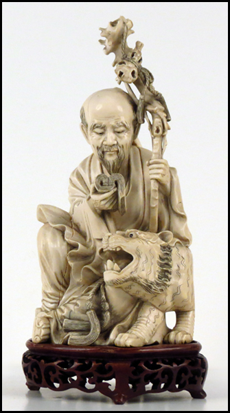CHINESE CARVED IVORY FIGURE OF A
