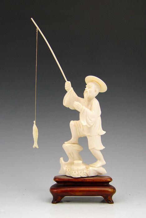 CHINESE CARVED IVORY FIGURE OF A