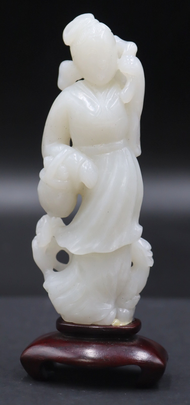 CHINESE CARVED WHITE JADE FIGURE OF