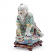 CHINESE CERAMIC BOY RIDING A T