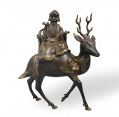 CHINESE GILT BRONZE SCHOLAR ON