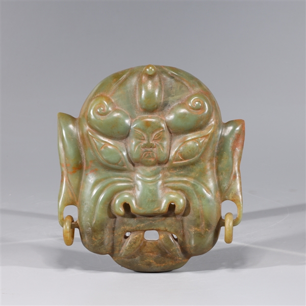 Chinese hardstone mask carving with