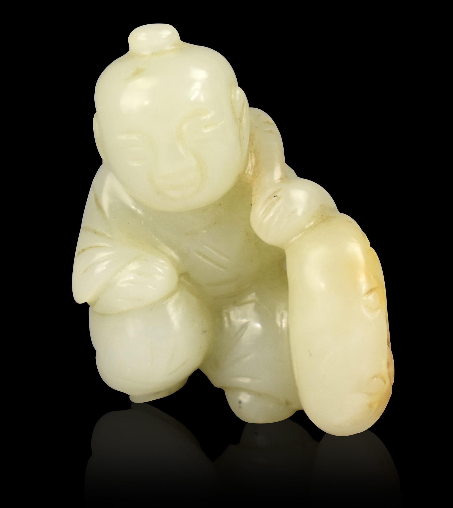 CHINESE JADE CARVING OF BOY HOLDING