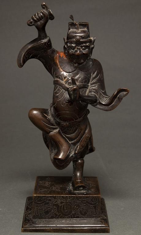 Chinese patinated bronze figure