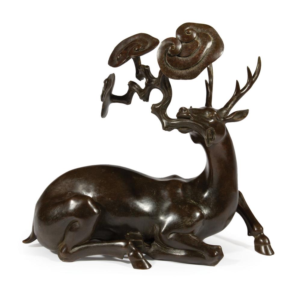 CHINESE PATINATED BRONZE OF A