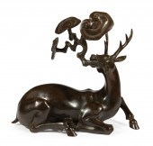 CHINESE PATINATED BRONZE OF A
