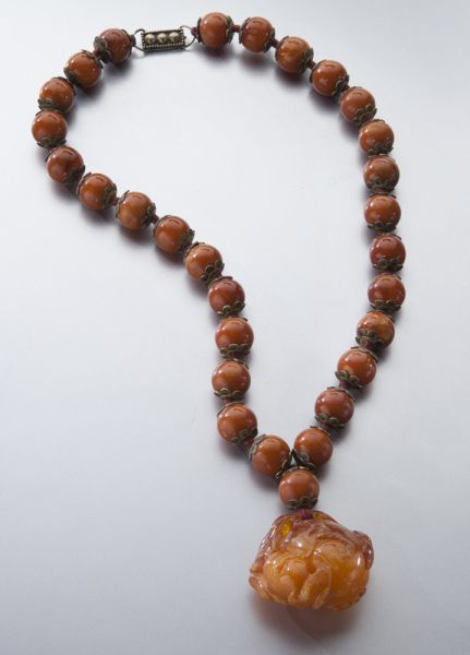 Chinese Qing carved mila amber