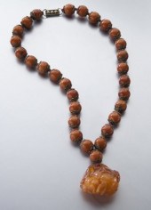 Chinese Qing carved mila amber