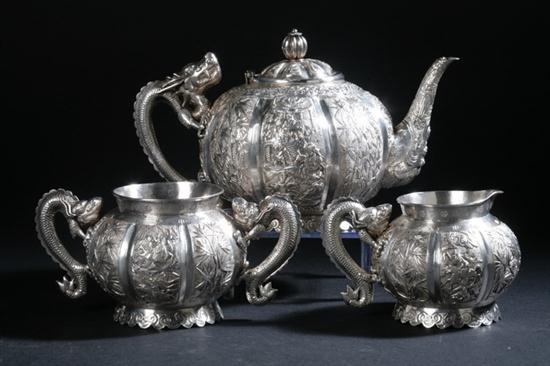 CHINESE SILVER THREE-PIECE TEA SET.
