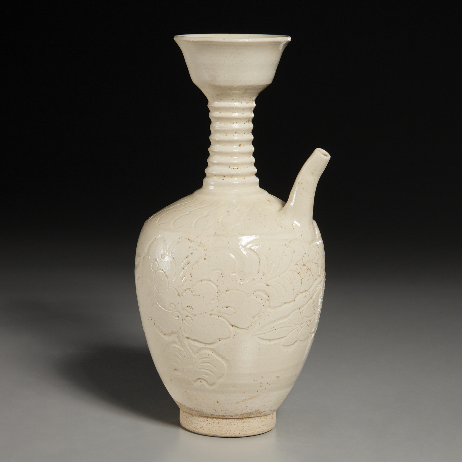 CHINESE WHITE-GLAZED CARVED EWER