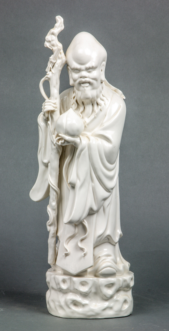 CHINESE WHITE GLAZED FIGURE OF