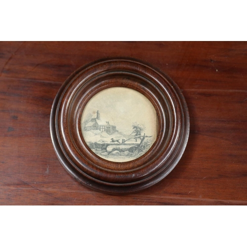 Circular framed print of a dog