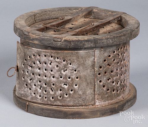 CIRCULAR PUNCHED TIN FOOT WARMER,