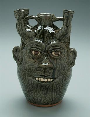 Cleater Meaders face candelabra,