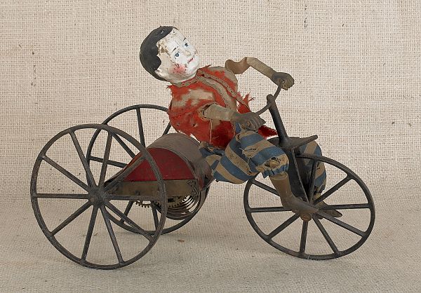 Clockworks wind-up boy on bicycle 8