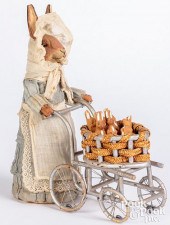 CLOTH DRESSED RABBIT PUSHING A