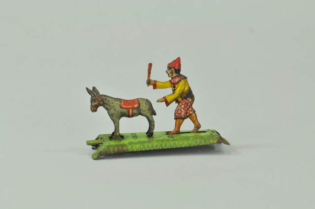 CLOWN CHASING DONKEY PENNY TOY