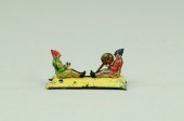CLOWNS TOSSING BALL PENNY TOY