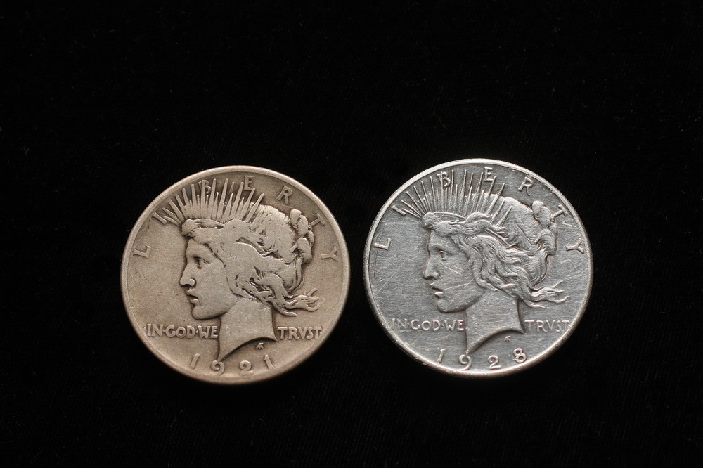 COINS - (2) Peace silver dollars