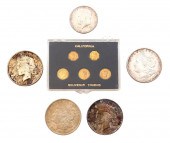 COINS: FOUR US SILVER DOLLARS,