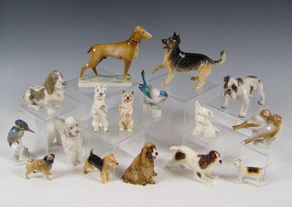 COLLECTION OF 16 PORCELAIN DOGS AND