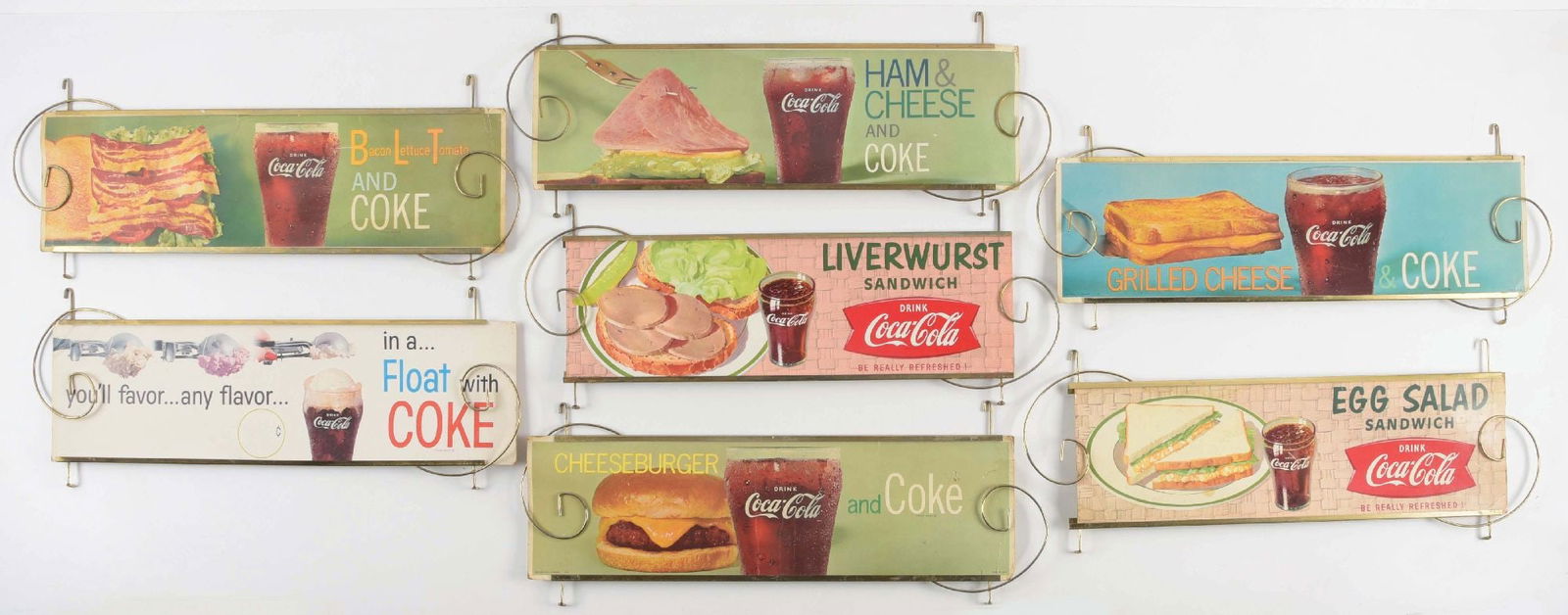 COLLECTION OF 7 COCA-COLA CARDBOARD