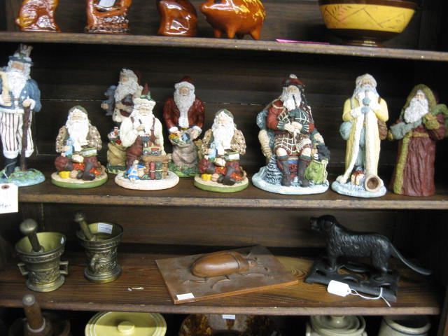 Collection of 9 Santa Figurines