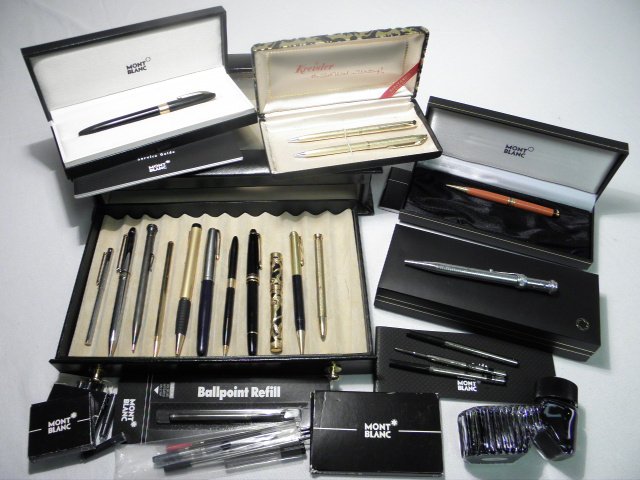 Collection of assorted pens.