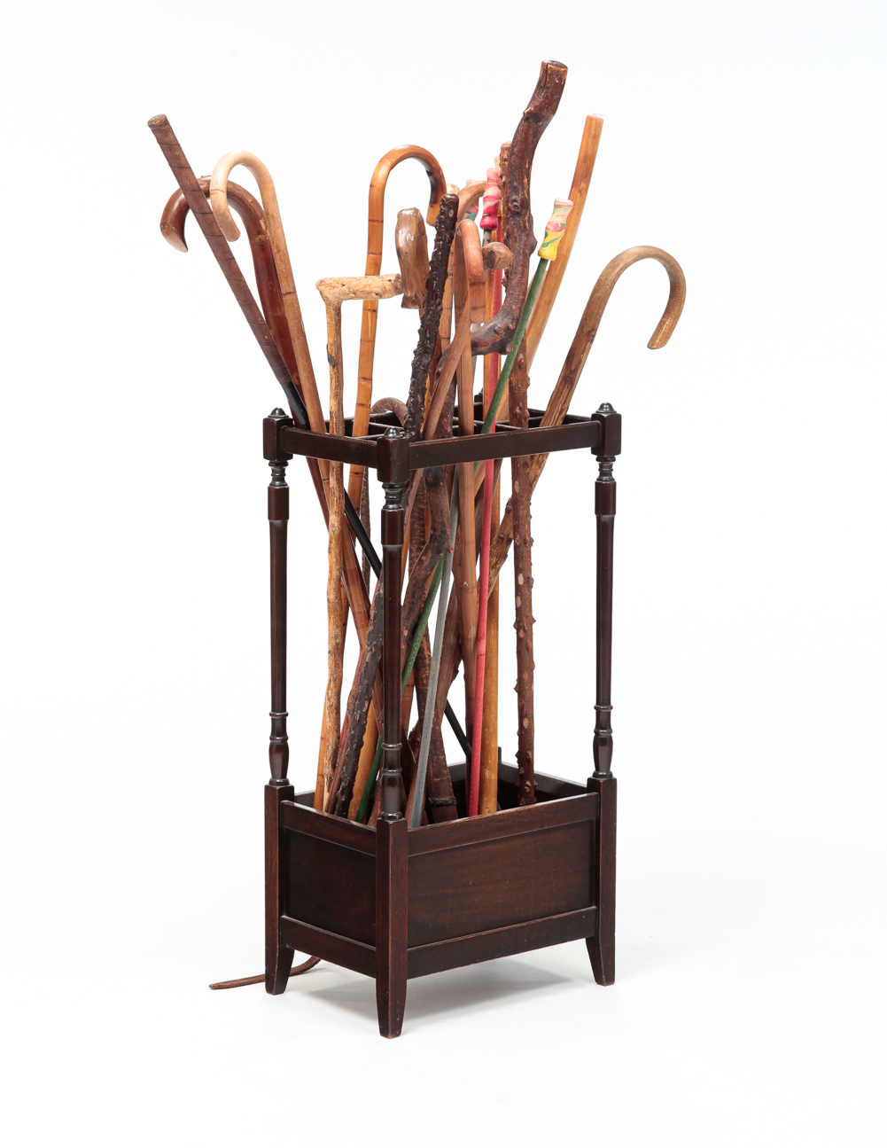 COLLECTION OF CANES IN A STAND.
