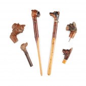 COLLECTION OF CARVED DOG'S HEA