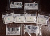 COLLECTION OF EIGHT UNSET GREE