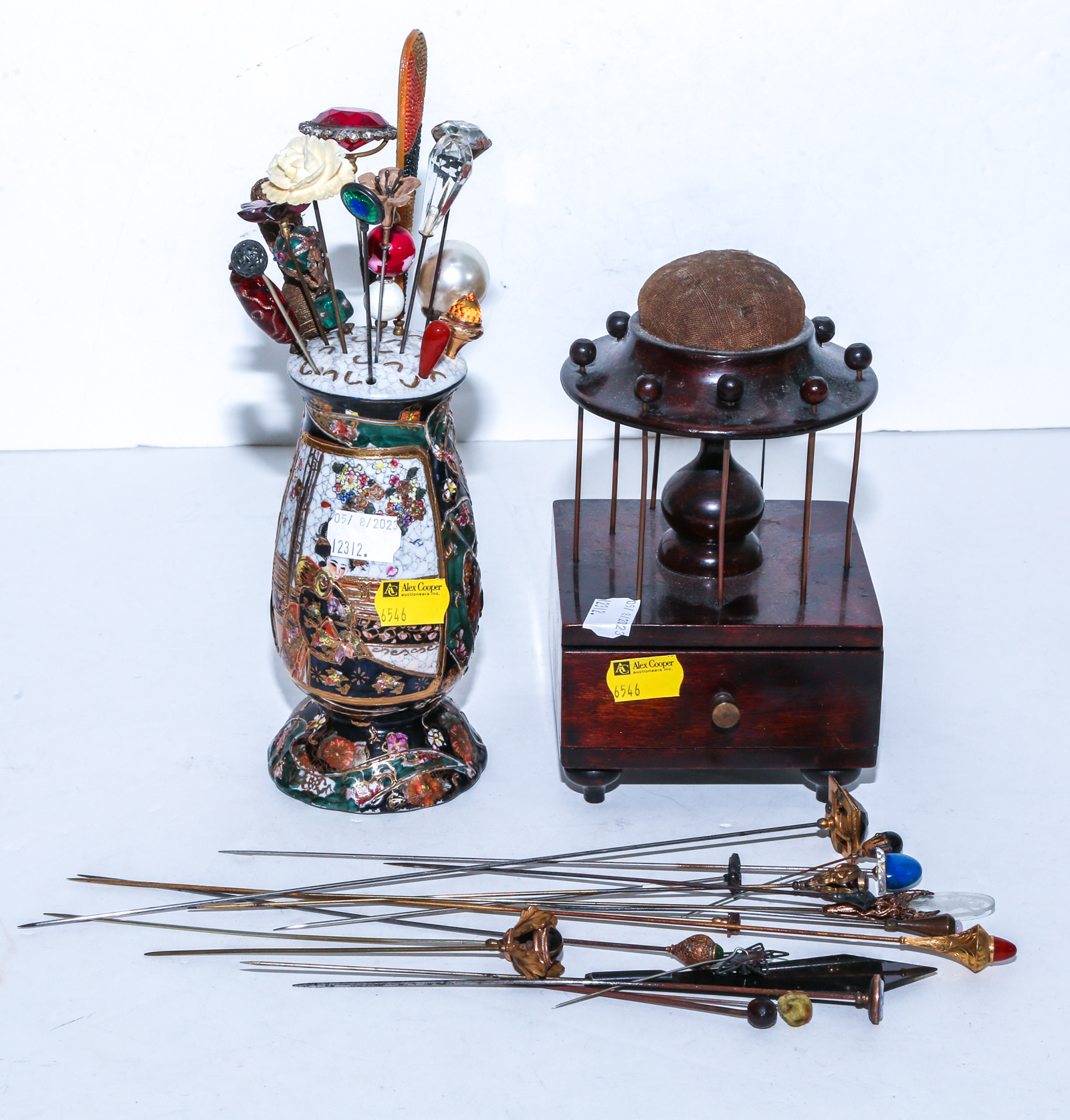 COLLECTION OF HATPINS, A HOLDER &